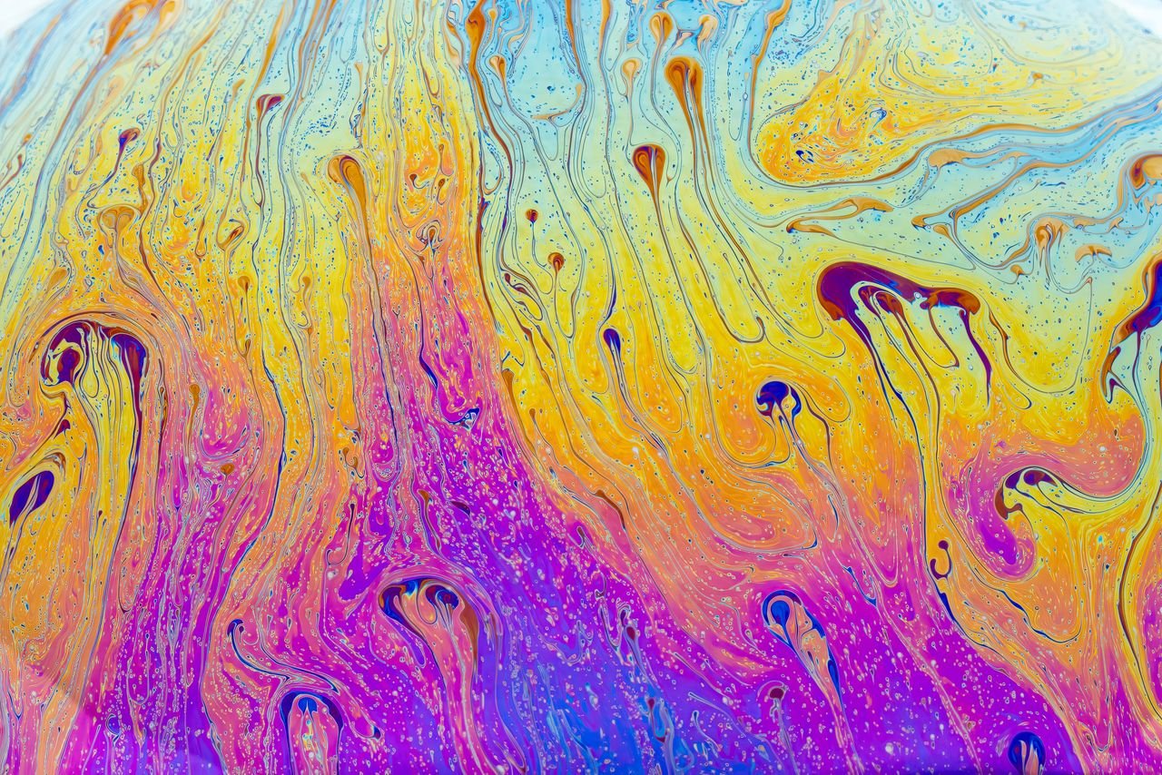gallery-1 Fluid pattern of swirling vivid colors creating an abstract vibrancy